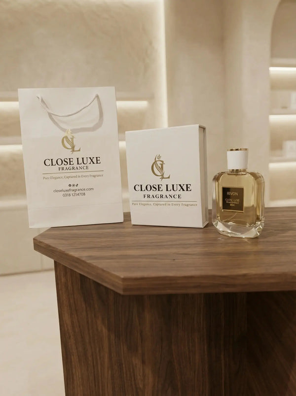 Luxury Rivon perfume bottle with elegant packaging and shopping bag on wooden table